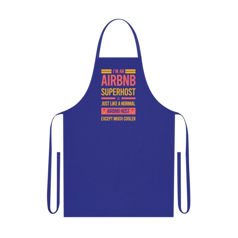 Product: I'm an Airbnb Superhost Cotton Apron, featuring a blue design with the text "I'm an Airbnb Superhost, just like a normal Airbnb host except much cooler" printed in vibrant yellow and pink.