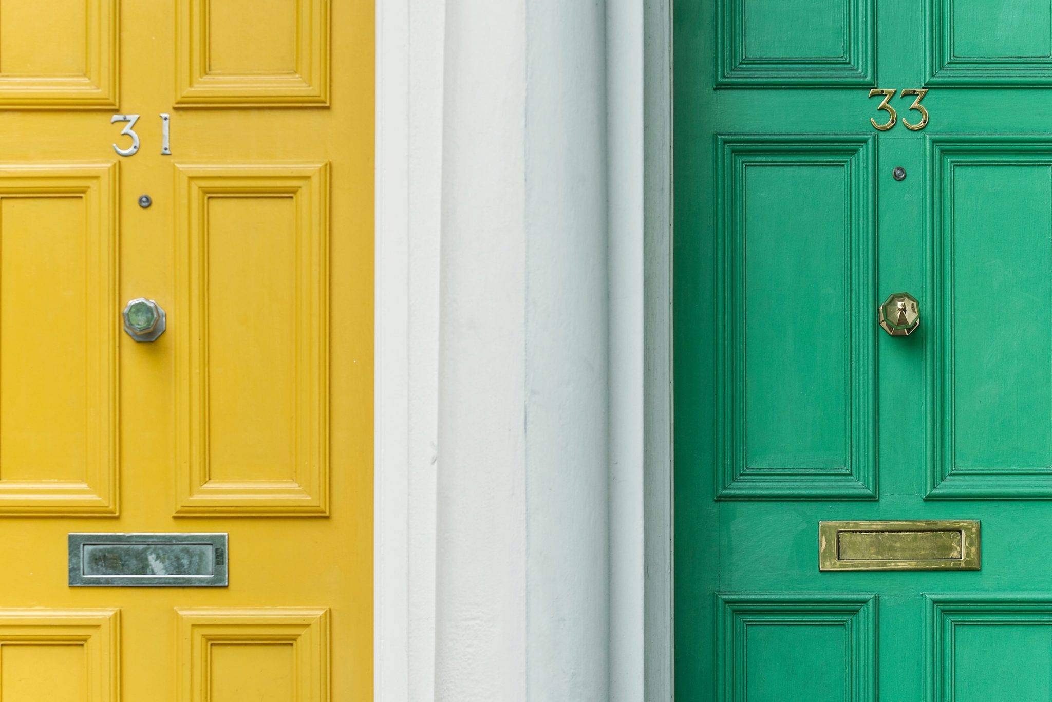 Airbnb Hosting Two Airbnb hosting doors with numbers on them.