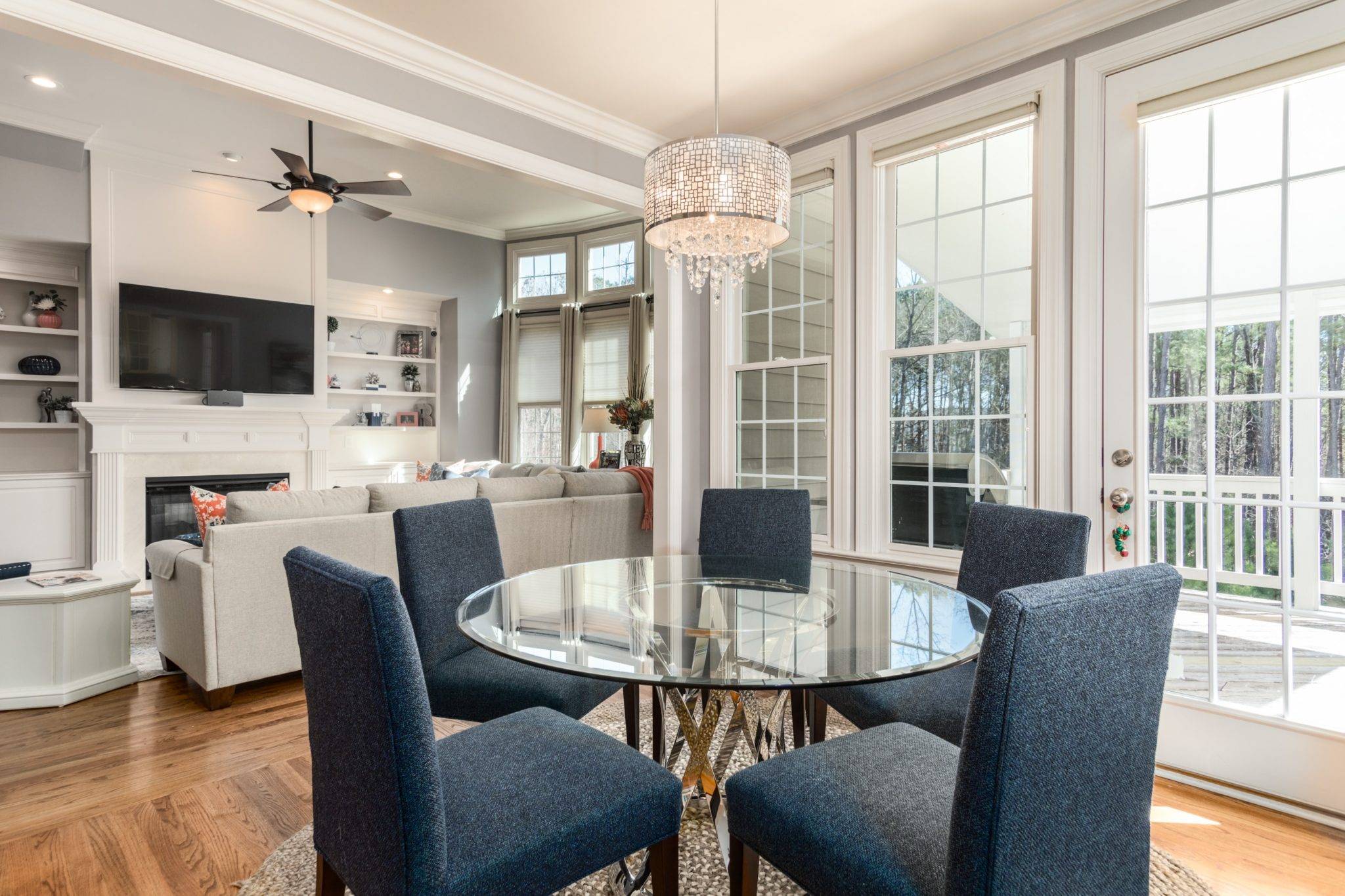 Airbnb Hosting An Airbnb hosting with a modern glass dining table and chairs.