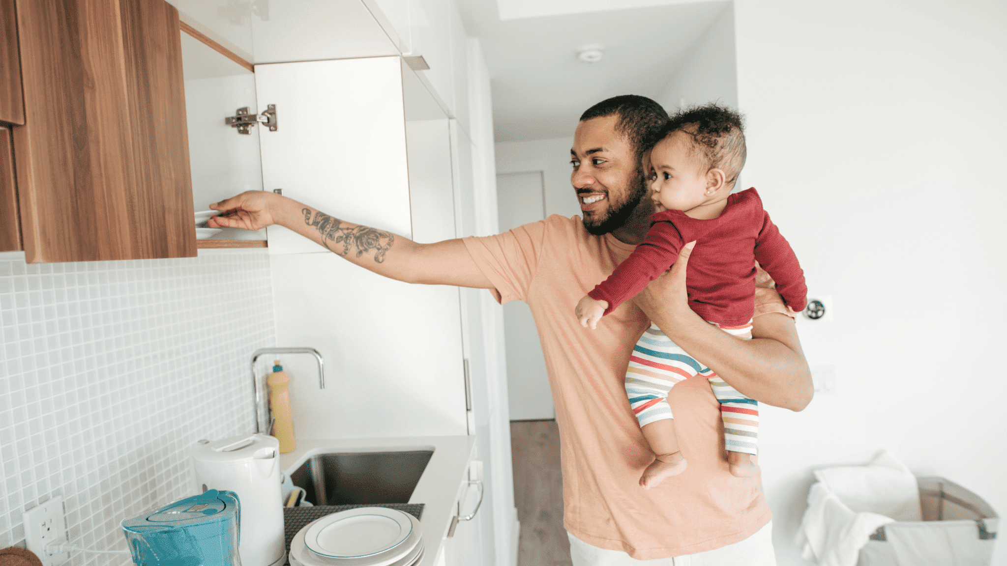 Airbnb Hosting A man holding a baby in an Airbnb.
