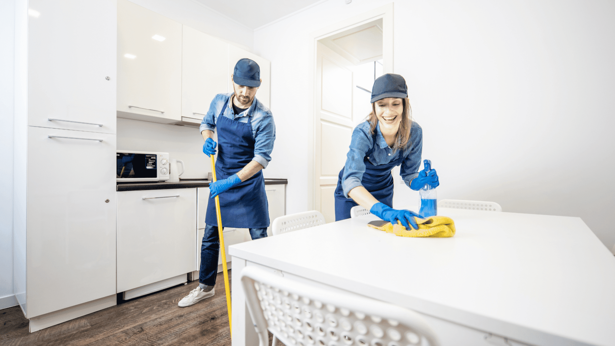 Airbnb Hosting Two maids cleaning a kitchen table for an Airbnb hosting business.
