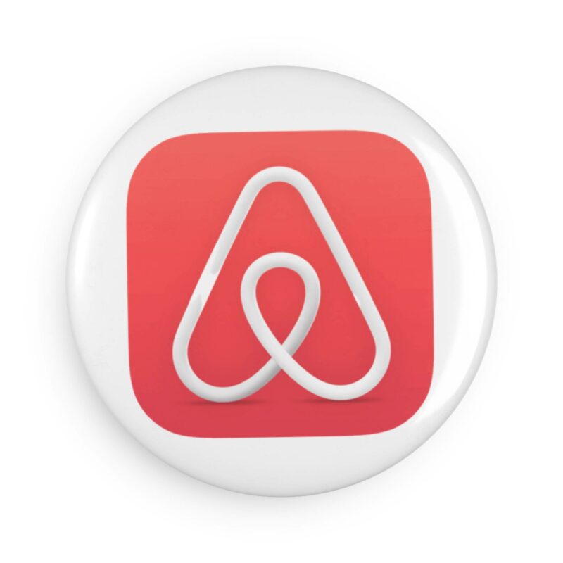A round Airbnb Button Magnet featuring a stylized white "A" on a red background.