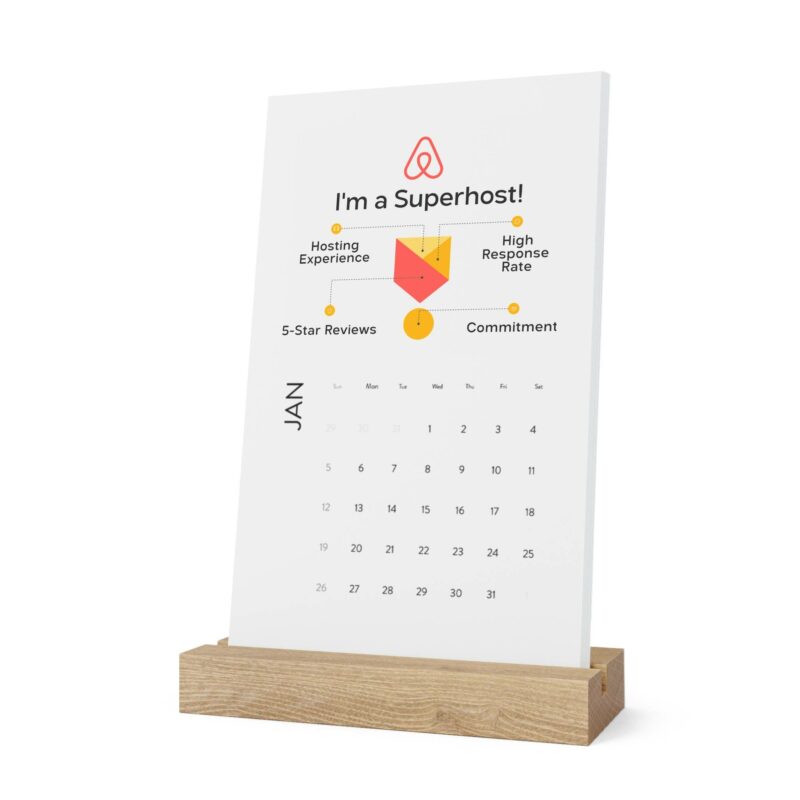 A Vertical Desk Calendar (2022) featuring the Airbnb logo, displaying January and highlighting achievements such as hosting experience, high response rate, 5-star reviews, and commitment. The title reads "I'm a Superhost!".