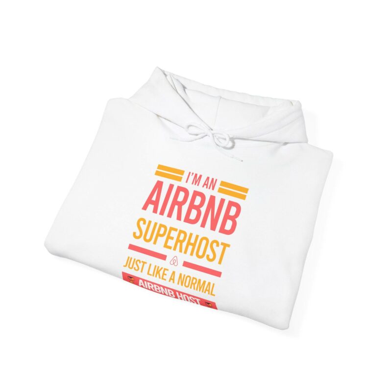 A white "I'm an Airbnb Superhost Unisex Heavy Blend Hooded Sweatshirt" featuring the text "I'M AN AIRBNB SUPERHOST, JUST LIKE A NORMAL HOST, BUT WITH MORE AWESOME" printed on the front in orange and pink.