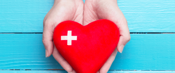 Airbnb Hosting A red heart with a swiss cross in a woman's hands, perfect for Health and Wellness Listings.